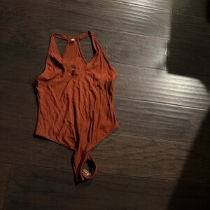 FP Movement by Free People Rust Ribbed Bodysuit